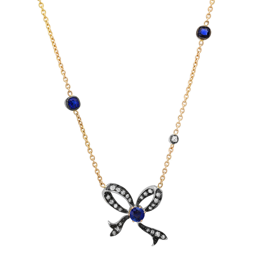 Vintage natural sapphire and diamond bow pendant in silver and 14kt gold