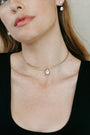 Bouton Lab-Grown Cushion Brilliant Diamond Pendant 3.5 ct in 18kt gold on torque necklace and zoomed in on model