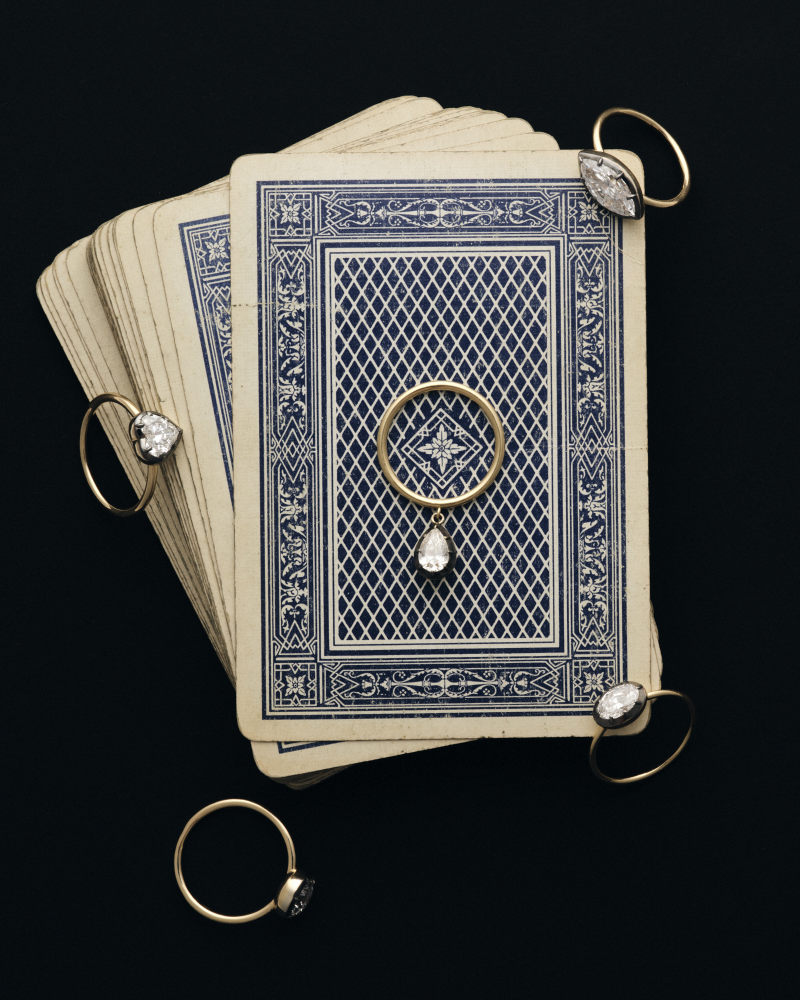 De La Paix lab-grown diamond rings resting on antique playing cards