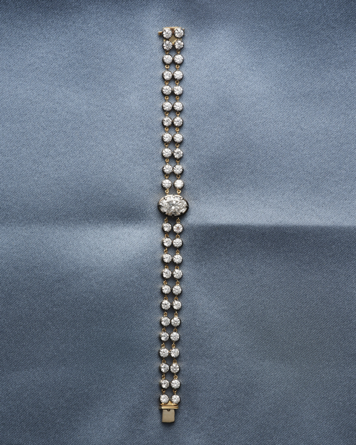 Diamond line bracelet on blue silk
