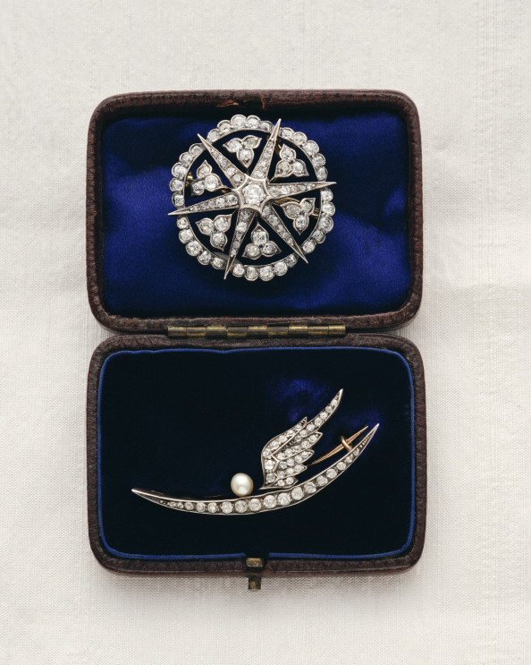 Antique diamond star brooch and crescent swallow brooch in a velvet box