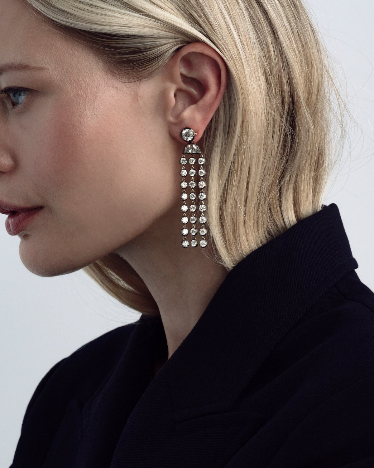 Model wearing De La Paix lab-grown diamond chandelier earrings