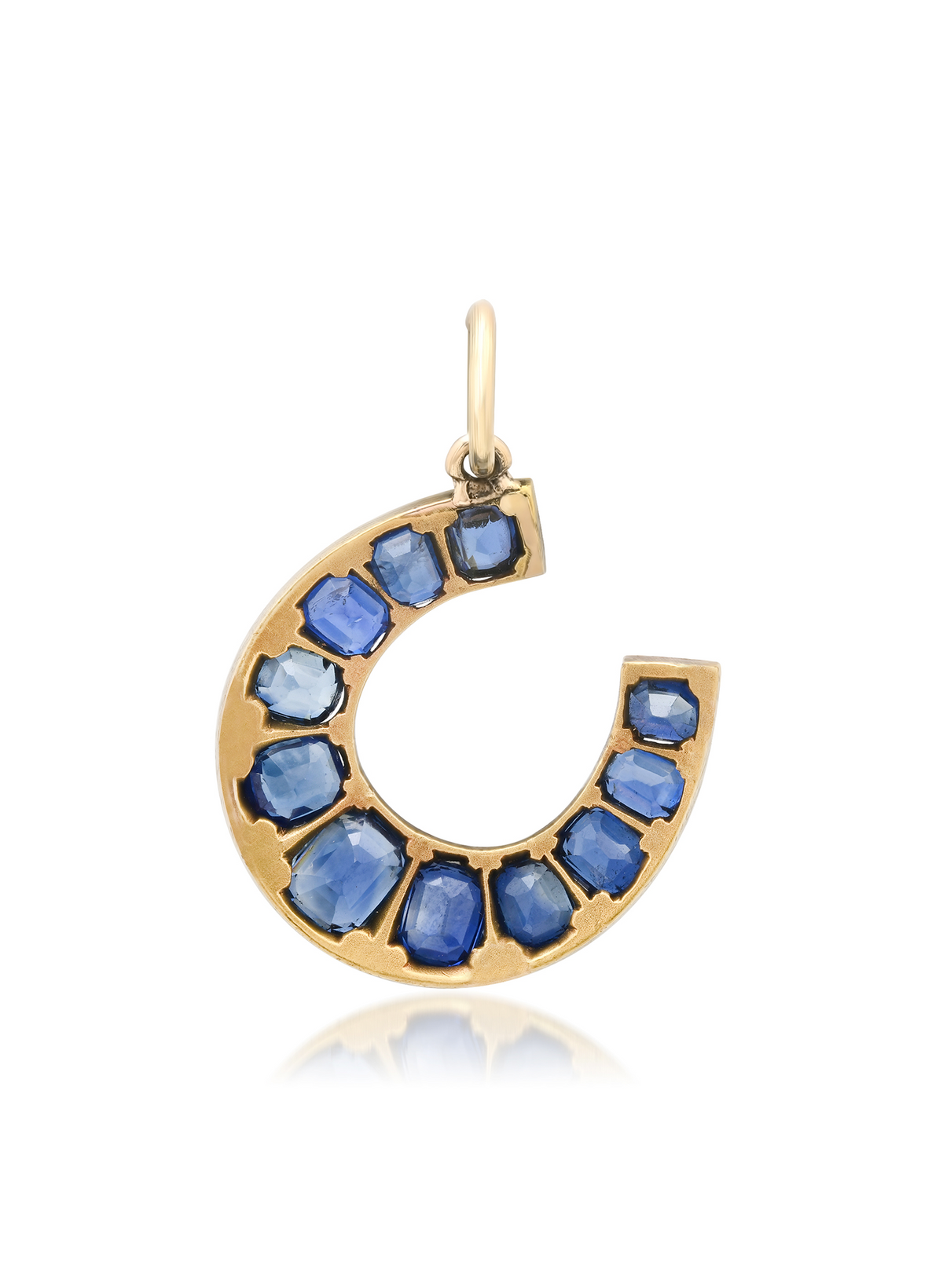 Vintage Victorian sapphire and diamond horseshoe gold charm, angled view